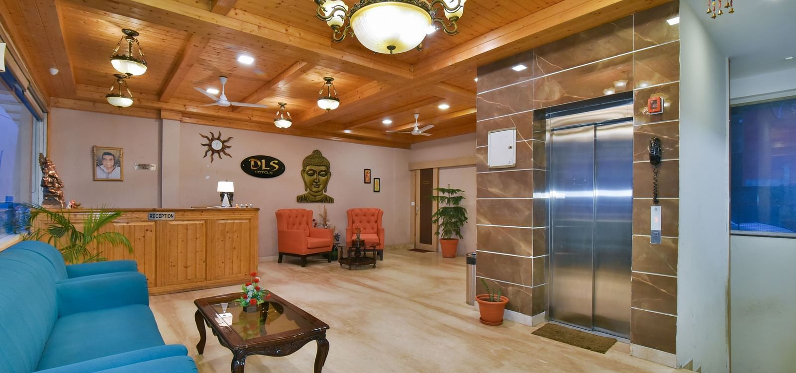 Reception area with a desk placed near the sofa at DLS Highland Resort and Spa, Mussoorie.
